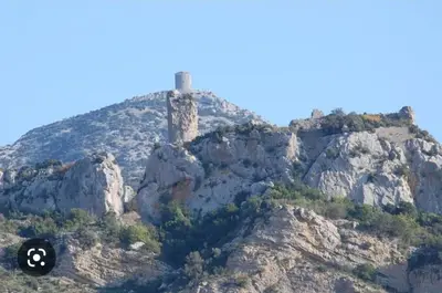 a hill with a tower on top of a mountain at Détente et plaisir à Taltahull in Tautavel