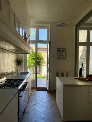 a kitchen with a stove and a counter top at Maison Hortense Carcassonne in Carcassonne