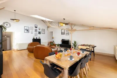 a living room with a table with fruit on it at Loft Sénéchal - Rare Elegance in Carcassonne