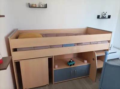 a bunk bed with a desk and a bed in a room at Chez Sabine la Campagne HAUT in Narbonne