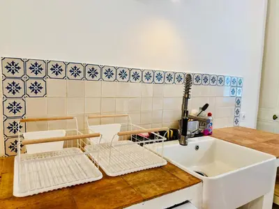 a kitchen with a sink and a counter top at Domaine Riplou - Maison de Campagne avec piscine in Verdun-en-Lauragais