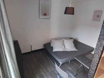 a small room with a table with two pillows on it at Mas Dels Caminhs in Villepinte