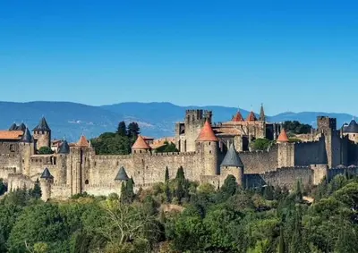 a large castle sitting on top of a hill at La maison du soleil in Villar-Saint-Anselme