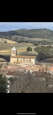 a large building in the middle of a field at La maison du soleil in Villar-Saint-Anselme