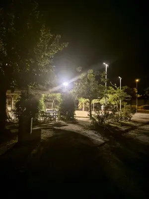 a park lit up at night with street lights at Mobil-home Climatisé 6 personnes à Port La Nouvelle in Port-la-Nouvelle