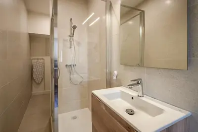a bathroom with a sink and a shower at Studio Blue Délice in Narbonne