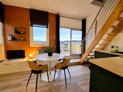 a kitchen and dining room with a table and chairs at - L'Evasion - Vue panoramique in Gruissan