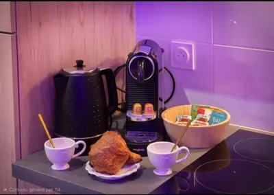 a counter with two cups of coffee and some bread at Le bridgerlove Tantra Jacuzzi Unique in Quillan