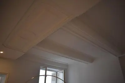 a coffered ceiling with a window in a room at L'Opaline in Carcassonne