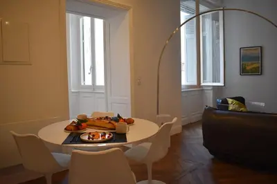 a room with a table with a plate of food on it at L'Opaline in Carcassonne