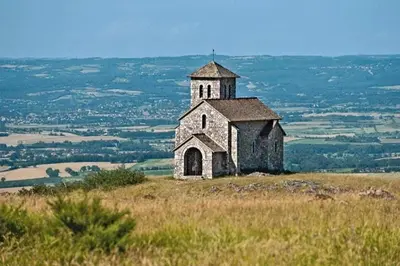 an old church on the top of a hill at La maison au bout de l'allée in Carbes