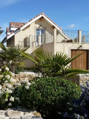 a house with a balcony on the side of it at Charming cottage style property nestled in stunning French countryside near Carcassonne and Mirepoix in Hounoux