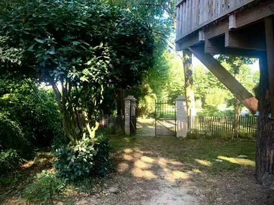 a fence with a tree in front of a gate at 19Th Century Mansion With Pool Near Castres in Payrin-Augmontel