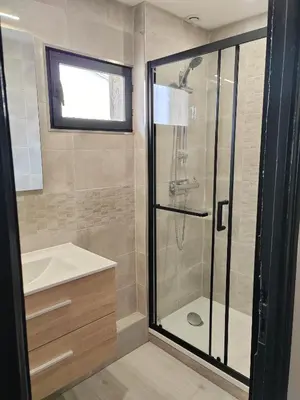 a bathroom with a shower and a sink at Beau T3 coeur village in Gruissan