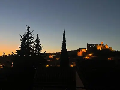 a view of a city at night at L'abeille in Durban-Corbières