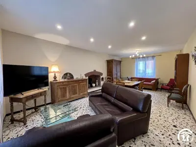a living room with a couch and a flat screen tv at Peyret in Cépie