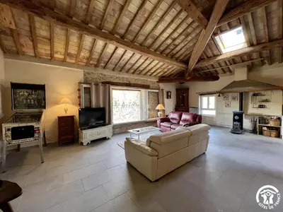 a living room with a couch and a tv at La ruche in Durban-Corbières