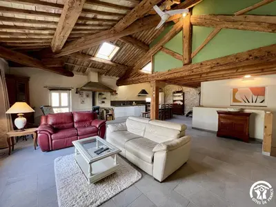 a living room with a couch and a table at La ruche in Durban-Corbières