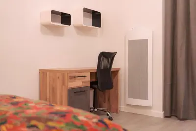 a desk with a chair in a room at La PARERIE 2 in Carcassonne