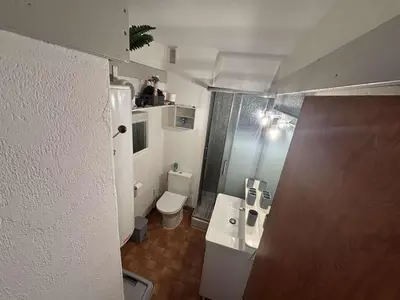 a small bathroom with a toilet and a shower at Appart 2 pièces Cabine PORT LA NOUVELLE PN590-022 in Port-la-Nouvelle