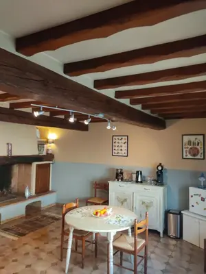 a kitchen with a table and chairs in a room at Chambre d'hôtes Zen à Mazamet, avec garage vélos motos in Mazamet