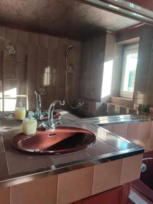 a bathroom with a sink with a candle on it at Chambre d'hôtes Zen à Mazamet, avec garage vélos motos in Mazamet