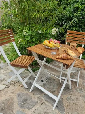 a wooden table with a bunch of fruits and vegetables on it at Chambre d'hôtes Zen à Mazamet, avec garage vélos motos in Mazamet