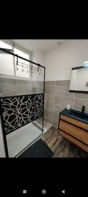 a bathroom with a sink and a mirror at Élégant studio avec jacuzzi in Saint-Paul-de-Fenouillet