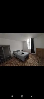 a bedroom with a bed and a window at Superbe Appart 4 chambres Terrasse vue sur les Montagnes in Saint-Paul-de-Fenouillet