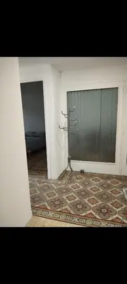 a room with a door and a rug in a room at Superbe Appart 4 chambres Terrasse vue sur les Montagnes in Saint-Paul-de-Fenouillet