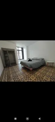 a bedroom with a bed and a fireplace at Superbe Appart 4 chambres Terrasse vue sur les Montagnes in Saint-Paul-de-Fenouillet