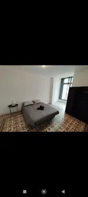 a bedroom with a bed and a tv in a room at Superbe Appart 4 chambres Terrasse vue sur les Montagnes in Saint-Paul-de-Fenouillet
