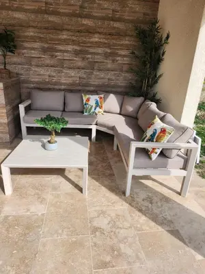 a couch and a coffee table on a patio at Villa Monze in Carcassonne