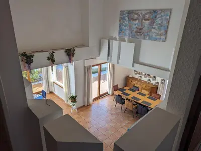an overhead view of a dining room and kitchen in a house at La Plénitude in Narbonne