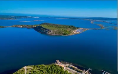 an island in the middle of a large body of water at Studio Cosy, proche du port, tout se fait à pied in Port-la-Nouvelle