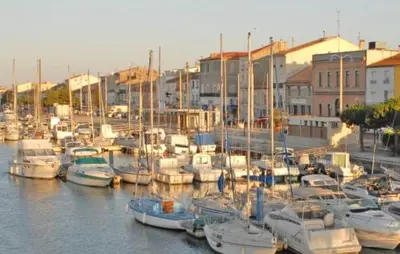 a bunch of boats are docked in a harbor at Studio Cosy, proche du port, tout se fait à pied in Port-la-Nouvelle