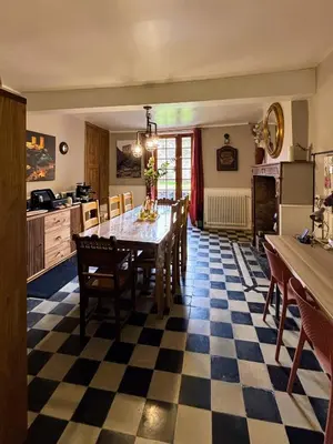 a kitchen and dining room with a table and chairs at Babouz Cottage in Mirepoix