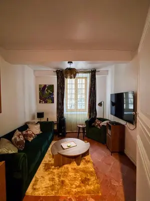 a living room with a couch and a coffee table at Babouz Cottage in Mirepoix