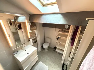 a small bathroom with a sink and a toilet at Maison 8 couchages - Port la Nouvelle - PN000-048 in Port-la-Nouvelle