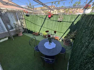 a patio with a table and chairs and a fence at Maison 8 couchages - Port la Nouvelle - PN000-048 in Port-la-Nouvelle