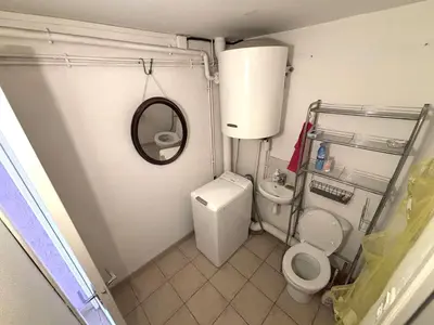 a small bathroom with a toilet and a mirror at Maison 8 couchages - Port la Nouvelle - PN000-048 in Port-la-Nouvelle