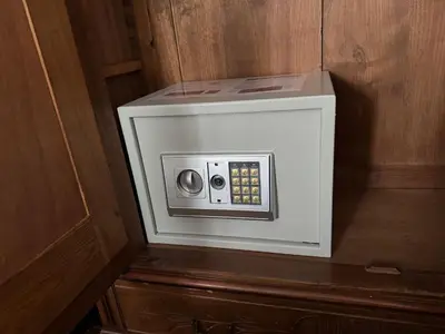 a white microwave oven in a wooden wall at Appartement Centre Ville in Mirepoix