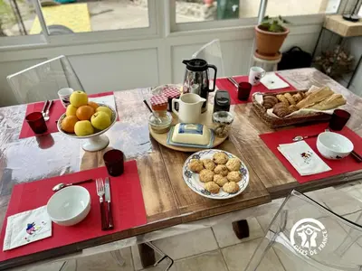 a wooden table with food on top of it at La cazabanelle in Villegly
