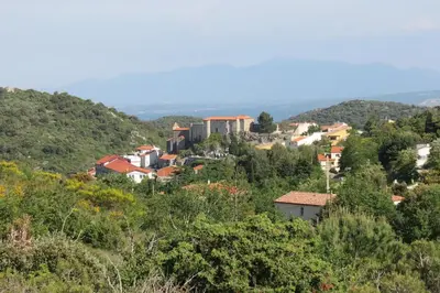 a village on a hill with trees and buildings at BELESTAGITE7 Pays Catalan 66 in Bélesta