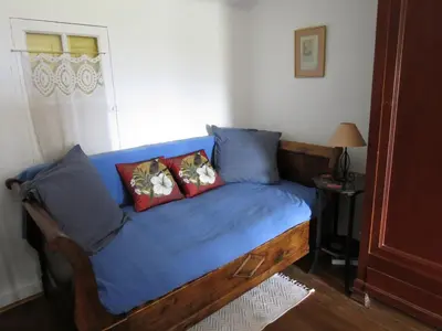 a bedroom with a blue bed with two pillows at BELESTAGITE7 Pays Catalan 66 in Bélesta