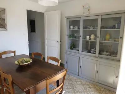 a dining room with a table and a hutch at BELESTAGITE7 Pays Catalan 66 in Bélesta