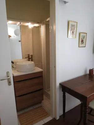 a bathroom with a sink and a vanity with a mirror at BELESTAGITE7 Pays Catalan 66 in Bélesta