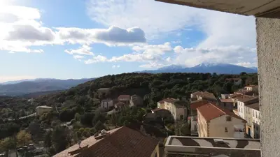 a view of a town with mountains and houses at BELESTAGITE7 Pays Catalan 66 in Bélesta