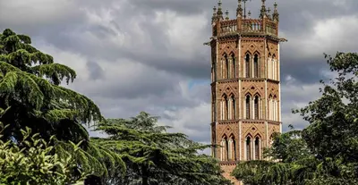 a tall tower with a clock on top of a building at L'Atelier des Carmes in Pamiers