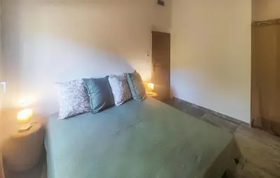 a room with a bed with two pillows on it at 3 Bedroom Stunning Home In Vieussan in Vieussan